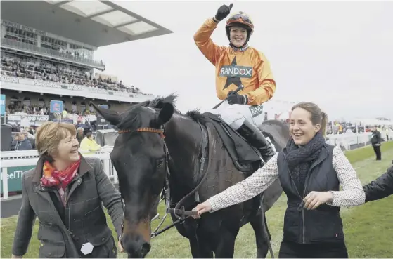  ??  ?? 2 Lizzie Kelly celebrates winning on Tea For Tea in the Betway Bowl Chase during day one of the Randox Health Grand National Festival at Aintree.