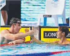  ?? Picture: GETTY IMAGES ?? Beaten in a bronze medal, Aussie Cameron McEvoy congratula­tes English 50m freestyle winner Benjamin Proud.