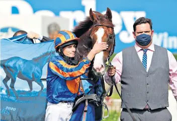  ??  ?? Big-hearted: Jockey Ryan Moore and Love after winning the Darley Yorkshire Oaks at York