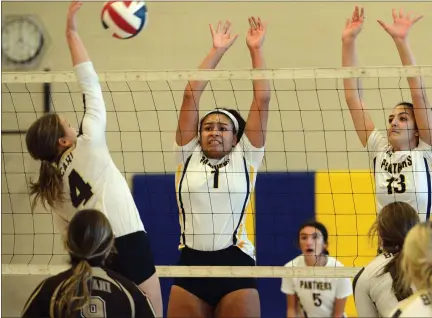  ?? MEDIANEWS GROUP PHOTO ?? Pope John Paul II’s Chelsea Harvey (1) and Caroline Regan (13) go up for a block against Bethlehem Catholic in their PIAA quarterfin­al match.