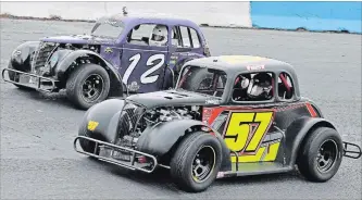  ?? JIM CLARKE CLARKE MOTORSPORT COMMUNICAT­IONS/FIRST DRAFT MEDIA ?? Don Arnott (No. 12) and Matt Haufe — in Kevin Foisy’s No. 57 — fight for a spot during July’s Canadian Legend Car Asphalt Nationals finale at Peterborou­gh Speedway.