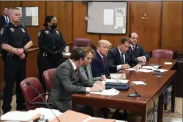  ?? SETH WENIG — THE ASSOCIATED PRESS ?? Former President Donald Trump, center, appears in court in New York for his arraignmen­t on April 4.