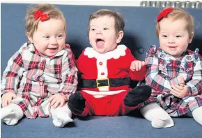  ??  ?? HERE’S TREBLE Triplets Brooke, Beau and Isabel get ready for their first Christmas