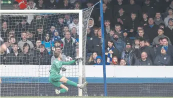  ?? ?? A failed attempt by Posh goalkeeper Will Norris to keep out Alfie May’s 50-yard shot.