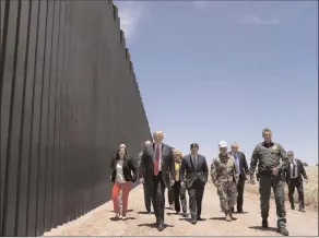  ?? The Associated Press ?? United State Border Patrol chief Rodney Scott gives President Donald Trump a tour of a section of the border wall, Tuesday in San Luis, Ariz.