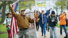  ?? ASSOCIATED PRESS FILE PHOTO ?? Opponents of a bill to repeal Connecticu­t’s religious exemption for required school vaccinatio­ns march down Capitol Avenue before the State Senate voted on legislatio­n, in Hartford, Conn.