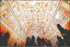  ?? (AP/Alessandra Tarantino) ?? Visitors admire the Sistine Chapel of the Vatican Museums on the occasion of the museum’s opening in Rome.