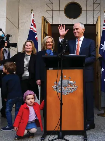  ?? Photo: LUKAS COCH ?? ON THE OUT: Former Prime Minister Malcolm Turnbull is surrounded by members of his family as he speaks after being toppled as Liberal Party leader yesterday.