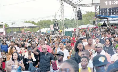  ?? FILE ?? Patrons are locked in to the performanc­es at Reggae Sumfest, held at the Catherine Hall venue in 2018.