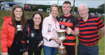  ??  ?? Donal Hannon, family members and godmother Jeanelle Griffin after Newmarket’s victory.