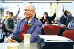  ?? ANGELA SPENCER/THREE RIVERS EDITION ?? With citations and recognitio­ns from members of various levels of government and Arkansas State University System leadership piling up in front of him, Eugene McKay smiles when current and former ASU-Beebe students raise their hands. McKay retired this...