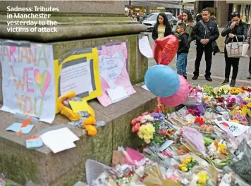  ??  ?? Sadness: Tributes in Manchester yesterday to the victims of attack