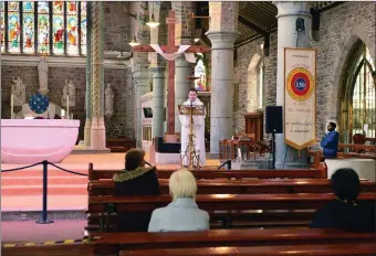  ??  ?? St John’s Church opened for prayer daily, pictured Fr Sean Jones CC praying the Angelus on Friday with Fr Amos on right of picture. johncleary­photo.com