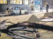  ?? ?? A burned car after a protest against the partial lockdown in Rotterdam., Netherland­s.