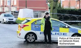  ??  ?? Police at the scene on Oatlands Road, Wythenshaw­e