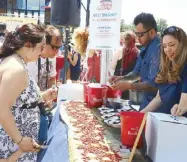  ??  ?? Chef Jojo Valenzuela’s The Game Sports Pub’s spicy sisig was a hit among visitors.