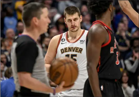  ?? AARON ONTIVEROZ — THE DENVER POST ?? Denver’s Nikola Jokic stares at referee Nick Buchert moments before his foul call against Michael Porter Jr. would be reversed upon a challenge by coach Michael Malone during Denver’s 118-113 win over the Toronto Raptors on Monday.