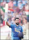  ?? (AP) ?? India’s Rohit Sharma raises his bat to celebrate scoring a century during the second one day internatio­nal cricket match between India and West Indies in Visakhapat­nam,
India, Dec 18.