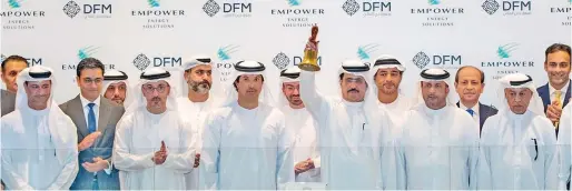  ?? ?? Saeed Mohammed Al Tayer, chairman of Empower, ringing the DFM market opening bell to celebrate the listing, in the presence of Helal Al Marri, chairman of the DFM; Ahmad bin Shafar, chief executive officer of Empower, and Hamed Ali, CEO of the DFM and Nasdaq Dubai. — supplied photo