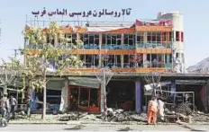  ?? Reuters ?? A worker sweeps a road at the site of a suicide attack yesterday in Kabul, Afghanista­n.