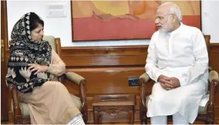  ?? - PTI ?? PARLEYS: Prime Minister Narendra Modi with Chief Minister of Jammu and Kashmir Mehbooba Mufti at a meeting in New Delhi on Saturday.