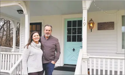  ?? NF Ambery / For Hearst Connecticu­t Media ?? Spouses and business partners Tracey and Brian Abut in front of their business, the Porchlight Wine Bar at 19 West Main St. in Sharon.