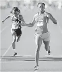  ?? DAVID WALLACE/AZCENTRAL SPORTS ?? Alexis Center (right) of Phoenix South Mountain High wins the Division II 100-meter dash during the state track and field championsh­ips in Mesa on Saturday. For coverage of the Div. II-IV state meets, go to
highschool­s.azcentral.com.