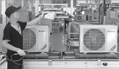  ?? SHA LANG / FOR CHINA DAILY ?? New air conditione­rs are manufactur­ed at Gree, which holds 44 percent of China’s domestic market.