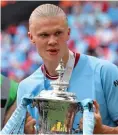  ?? GETTY IMAGES ?? In demand: City’s Haaland with the FA Cup