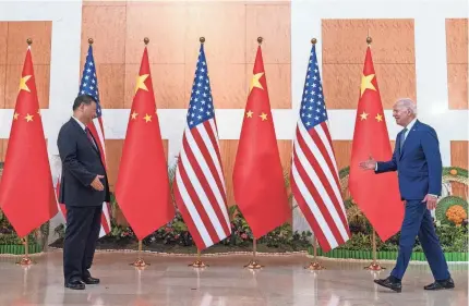  ?? ALEX BRANDON/AP ?? President Joe Biden joins Chinese President Xi Jinping ahead of a three-hour meeting between the two leaders at the G-20 summit in Bali, Indonesia. The U.S. has accused China of “provocativ­e” behavior in the Taiwan Strait.