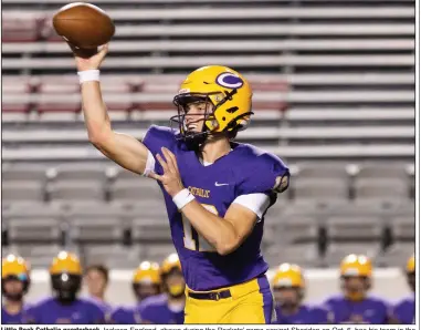  ?? (Arkansas Democrat-Gazette/Justin Cunningham) ?? Little Rock Catholic quarterbac­k Jackson England, shown during the Rockets’ game against Sheridan on Oct. 6, has his team in the thick of the race for the No. 2 playoff seed — and a first-round bye — from the 6A-East.