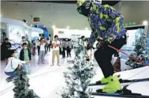  ?? ZHANG WEI / CHINA DAILY ?? A winter sports scene attracts visitors’ attention at Beijing’s Yanqing district pavilion during this year’s CIFTIS.