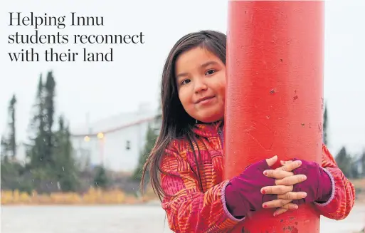  ?? KATRINA CLARKE PHOTOS ?? Vivica Dicker waits for school to start in Natuashish during a snowy day in October.