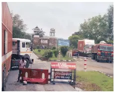  ?? PHOTO: N SUNDARESHA SUBRAMANIA­N ?? Trucks held up at a check-point in Rajasthan. While the time taken by trucks to travel between states has gone down, the benefits of the GST have not been uniform