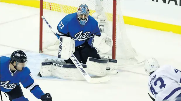  ?? KEVIN KING / POSTMEDIA NEWS ?? Winnipeg Jets goaltender Connor Hellebuyck is beaten on a shot by Toronto’s Nazem Kadri in Wednesday night action.