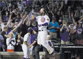  ?? Nam Y. Huh ?? The Associated Press Rookie David Bote rejoices as he nears home plate following his two-out, walk-off grand slam Sunday in the ninth inning of Cubs’ 4-3 victory over the Nationals.