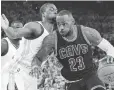  ?? KYLE TERADA, USA TODAY SPORTS ?? The Cavs’ LeBron James, right, drives against Harrison Barnes in the NBA Finals.