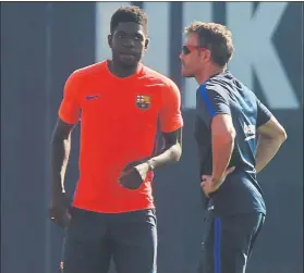  ?? FOTO: PEP MORATA ?? Umtiti, con Luis Enrique, durante un entrenamie­nto del FC Barcelona