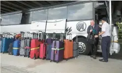  ?? JOE CAVARETTA/SOUTH FLORIDA SUN SENTINEL ?? Shuttle buses are one of the main means of transporta­tion to move cruise line passengers from Fort Lauderdale-Hollywood Internatio­nal Airport to awaiting ships at Port Everglades.