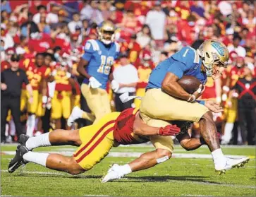  ?? Allen J. Schaben Los Angeles Times ?? STARTING IN 2024, the annual USC-UCLA football rivalry will be part of the Big Ten schedule. UCLA’s move is expected to negatively affect its sister campus UC Berkeley, already struggling with deficits.
