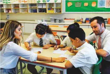  ?? Ahmed Ramzan/Gulf News ?? Students at GEMS Wellington Academy Al Khail in Dubai. The new good conduct certificat­e required of teachers in Dubai certifies that students are in safe hands, KHDA says.