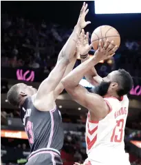  ?? AP FOTO ?? DRIVE. Houston Rockets guard James Harden drops two of his 35 points against Miami Heat center Bam Adebayo.