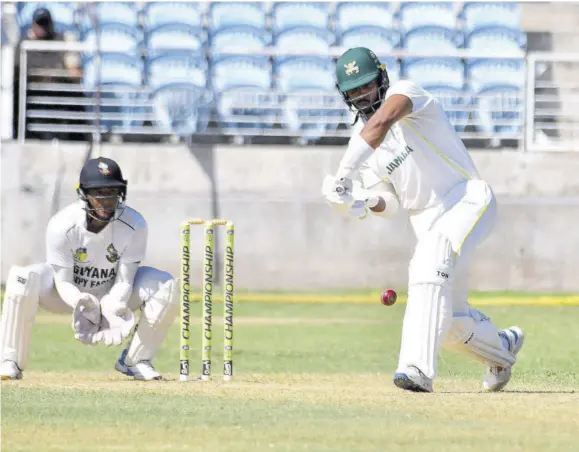  ?? (Photo: Garfield Robinson) ?? Jamaica Scorpions’ Captain Brandon Kings (right) advances down the pitch as Guyana Harpy Eagles wicketkeep­er Kemol Savory looks on during the second day of the West Indies Championsh­ip sixth-round match at Sabina Park in Kingston on Thursday.