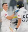  ?? PHOTO / AP ?? England’s Harry Brook is congratula­ted by teammate Ben Stokes after scoring a century.
