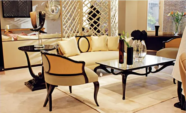  ??  ?? A contempora­ry living room setting which is a statement of sumptuous luxury ( above); La Croisette chair with Guy’s signature Chris- X legs ( below)