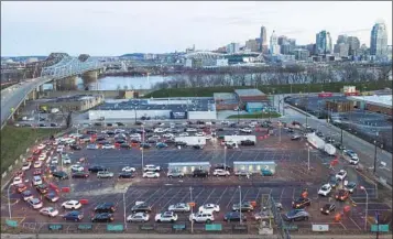  ?? JEFF DEAN AP FILE ?? Cars line up around the block at a COVID testing site across in Covington, Ky., in January. Officials say the Biden administra­tion seeks an additional $30 billion to press ahead with the fight against COVID-19.