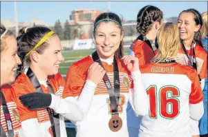  ?? SUBMITTED PHOTO/U SPORTS ?? Defender Becky Hanna of Howie Centre, centre, is shown with her U Sports bronze medal after the Cape Breton Capers women defeated the McMaster Marauders 1-0 on Sunday in Ottawa.