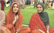  ?? DAMIAN GILETTO/DELAWARE NEWS JOURNAL ?? From left: Aisha and Tayyaba Farooq celebrate the end of Ramadan on April 21, 2023 at the Delaware Field House.