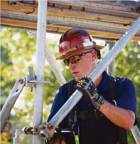  ?? Brock Group ?? Foreman Jack Collins demonstrat­es scaffold building. Brock Group has received awards for its commitment to safety.