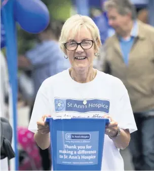  ?? CHRIS BULL ?? ●●Ann Garside collecting money for the hospice at a previous Summer Fair